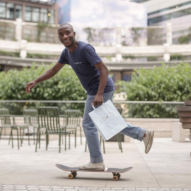 man delivers island poke on skateboard
